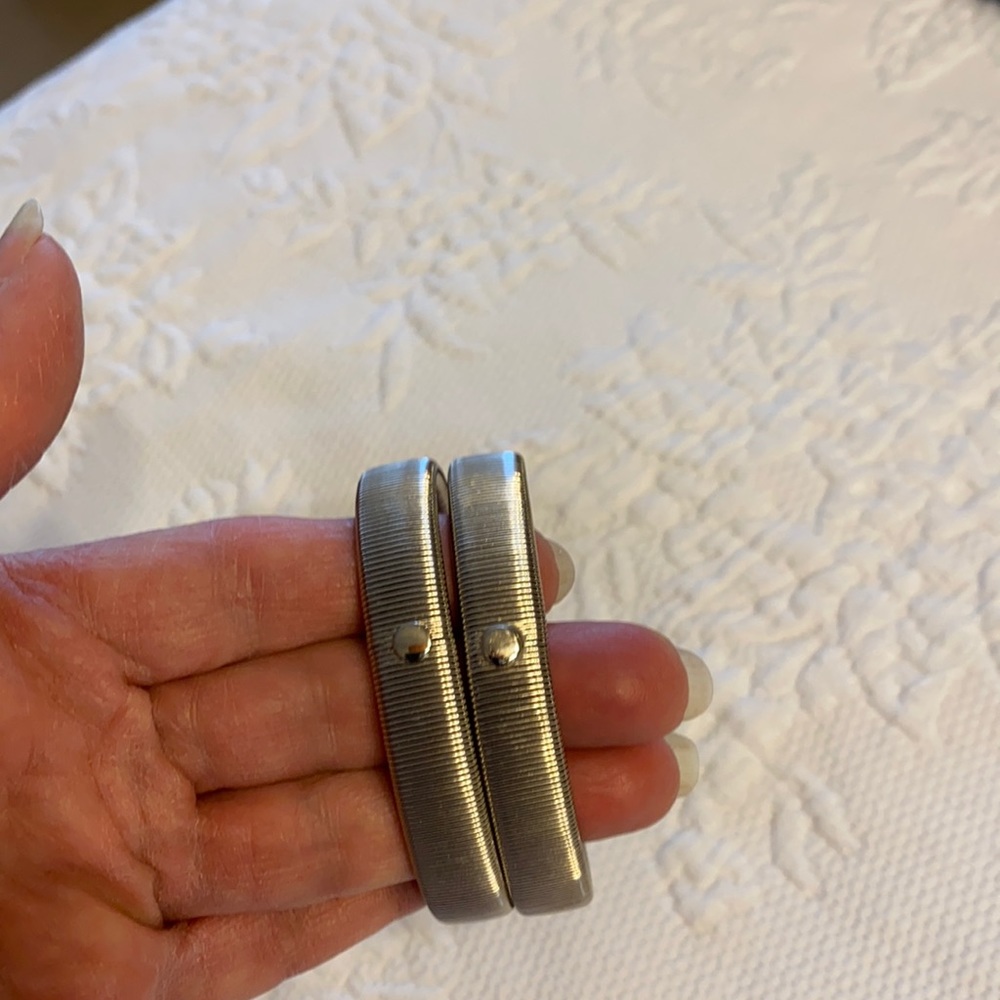2 silver tone stretch bracelets.